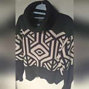 Chic Black and Cream Geometric Turtleneck Sweater